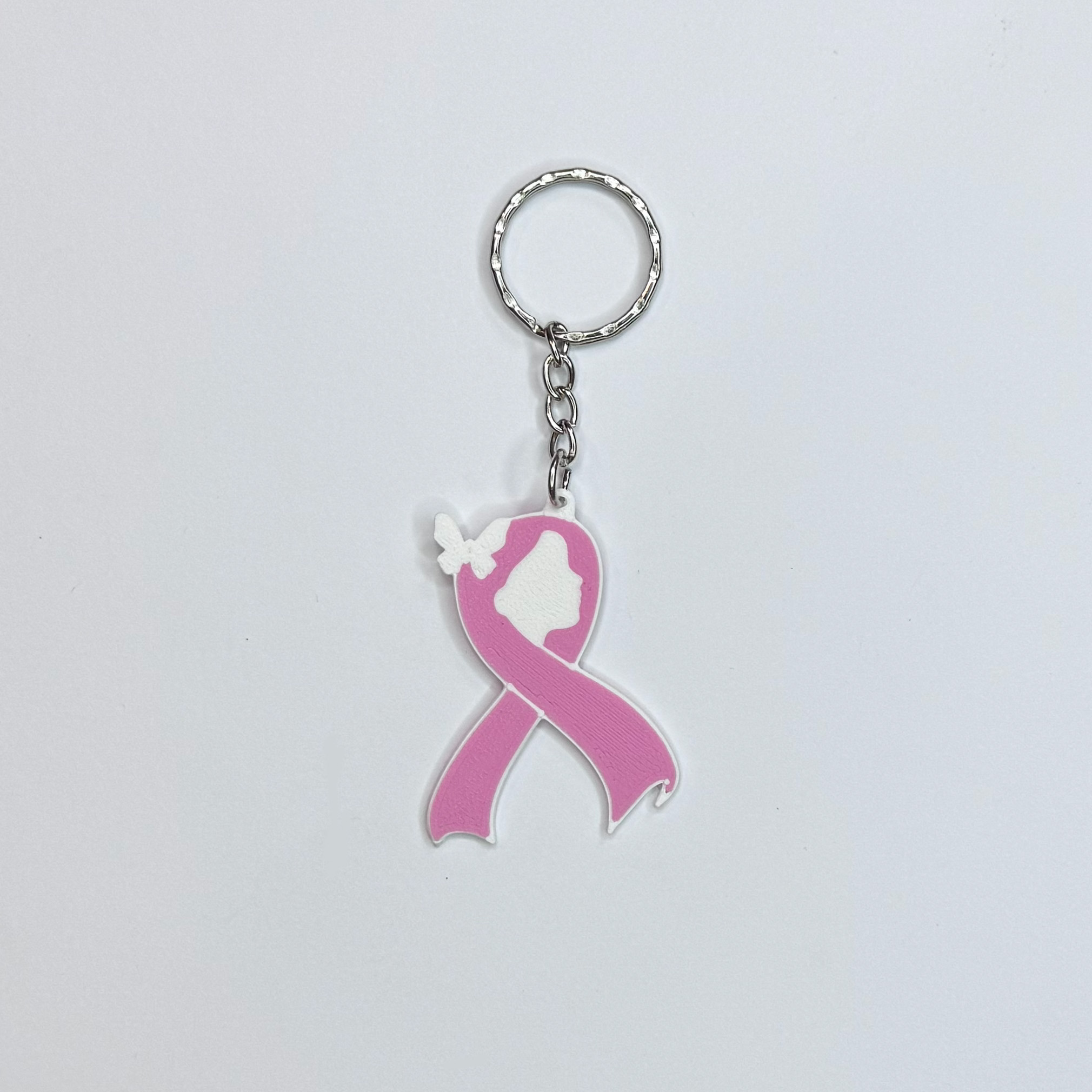 Llavero día de la mujer en forma de lazo